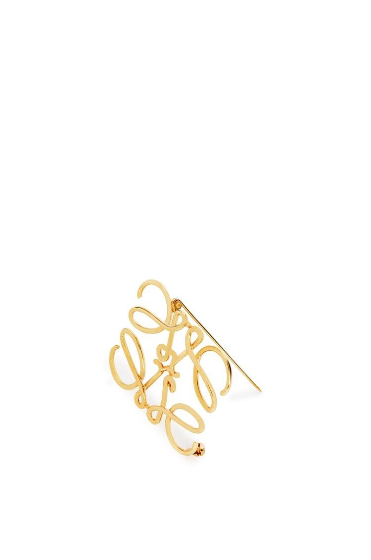 Anagram brooch in metal