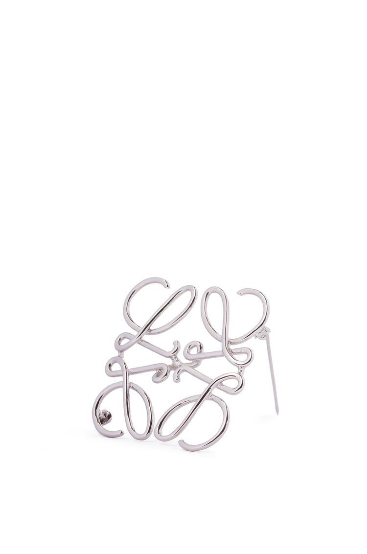 Anagram brooch in metal