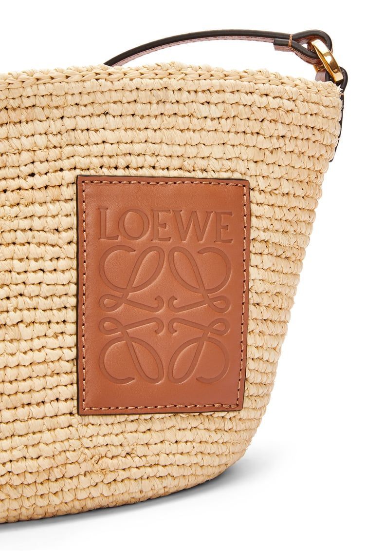 Slit Pochette bag in raffia and calfskin
