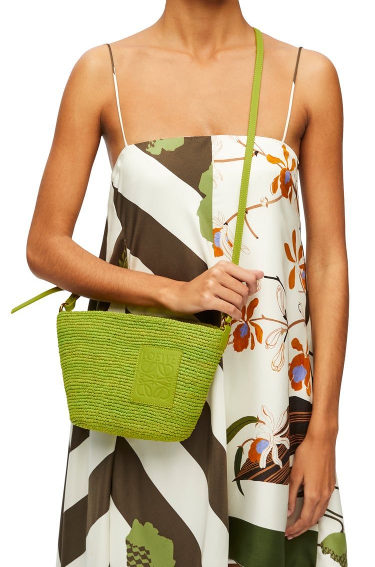 Slit Pochette bag in raffia and calfskin