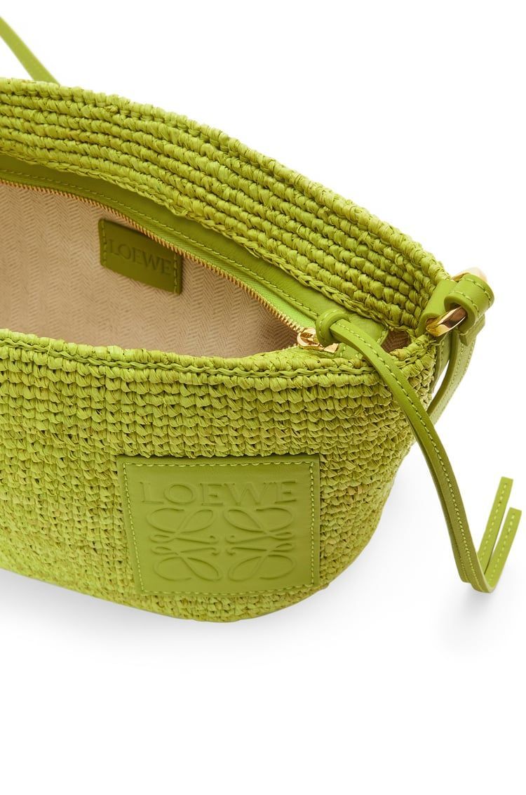 Slit Pochette bag in raffia and calfskin