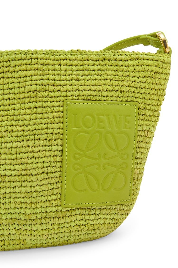 Slit Pochette bag in raffia and calfskin