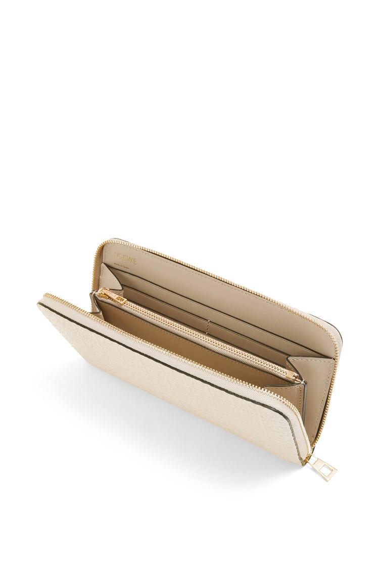 Repeat zip around wallet in embossed silk calfskin