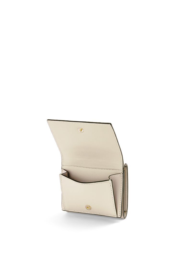 Repeat trifold wallet in embossed silk calfskin