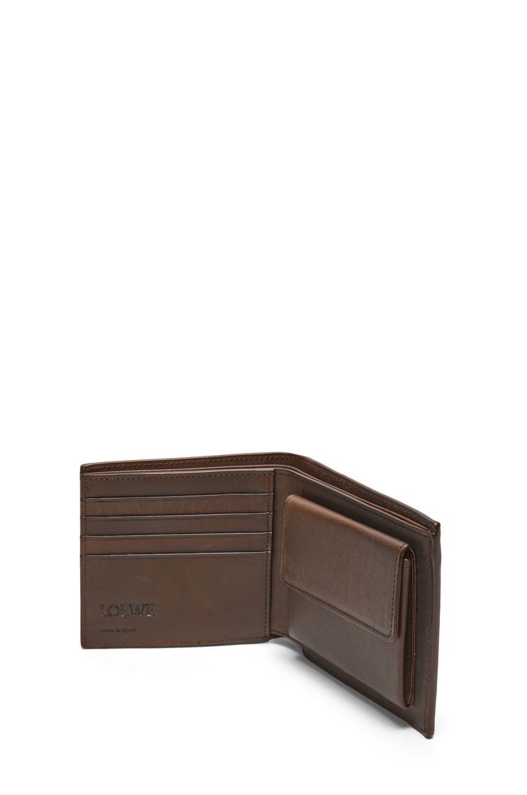 Bifold coin wallet in vegetable-tanned calfskin