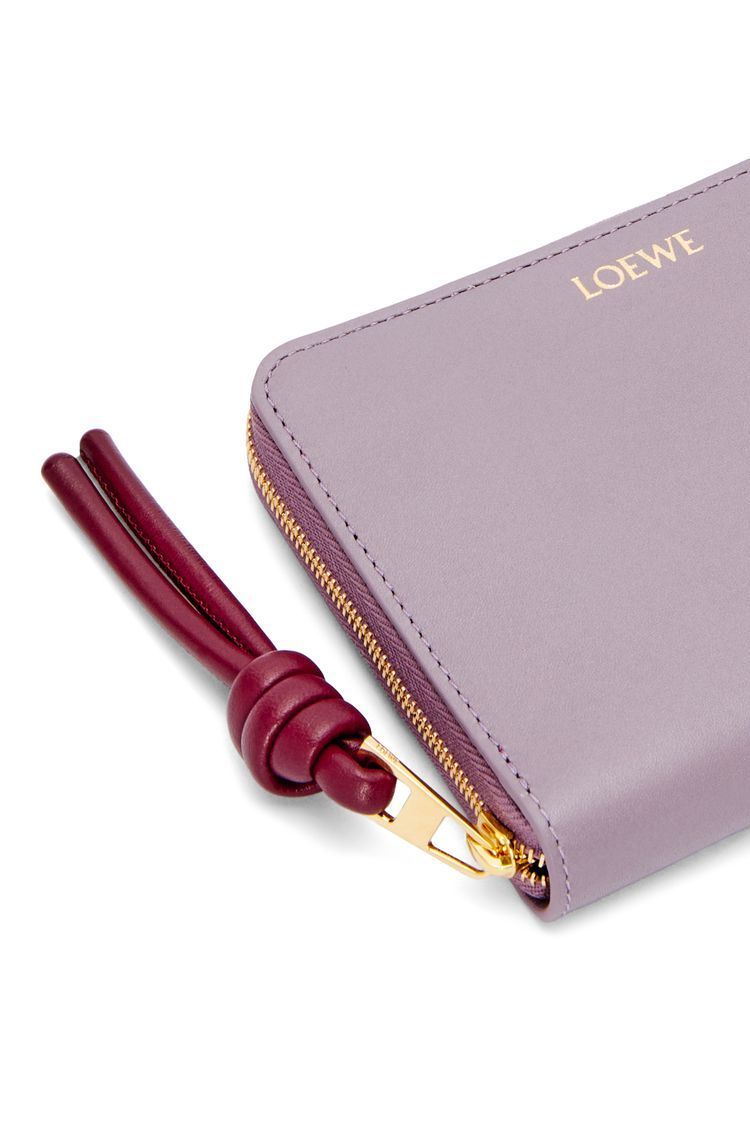Knot compact zip around wallet in shiny nappa calfskin