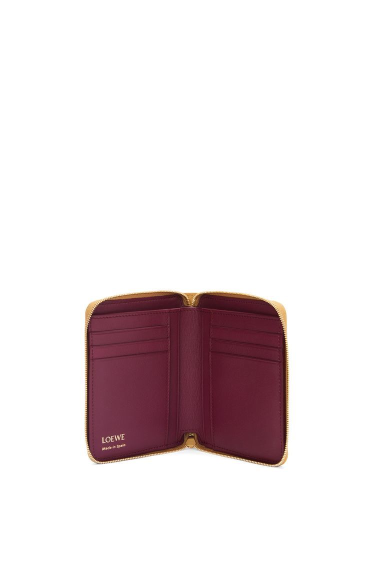 Knot compact zip around wallet in shiny nappa calfskin