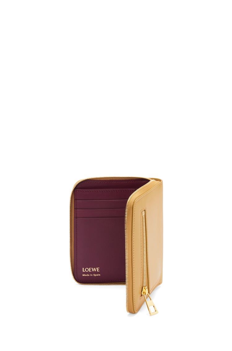 Knot compact zip around wallet in shiny nappa calfskin