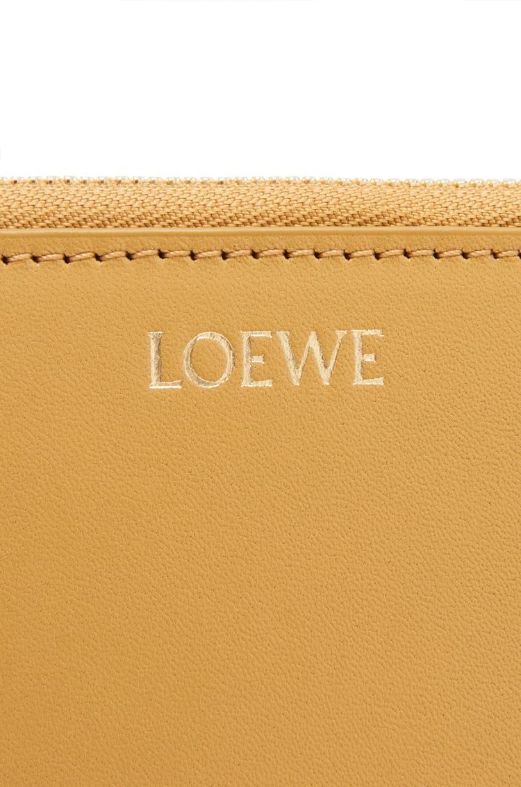Knot compact zip around wallet in shiny nappa calfskin