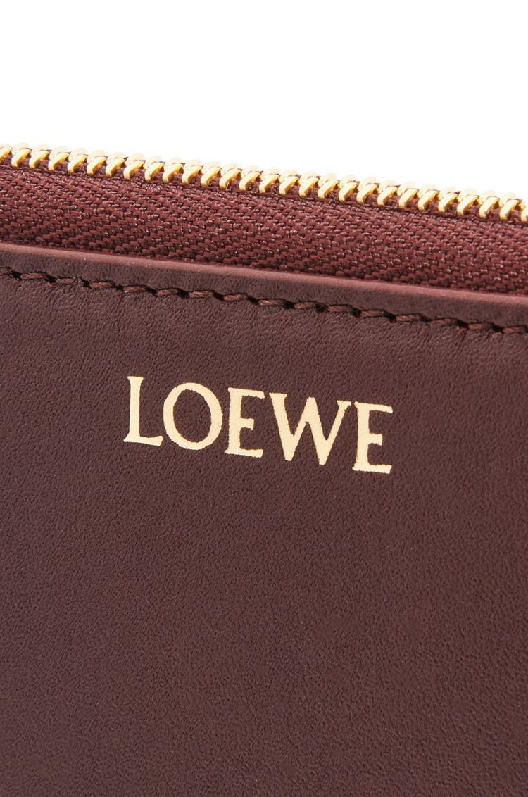 Knot compact zip around wallet in shiny nappa calfskin