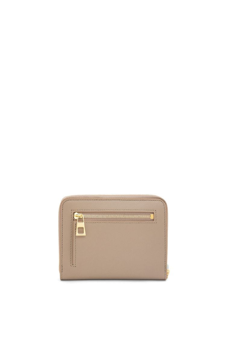 Knot compact zip around wallet in shiny nappa calfskin