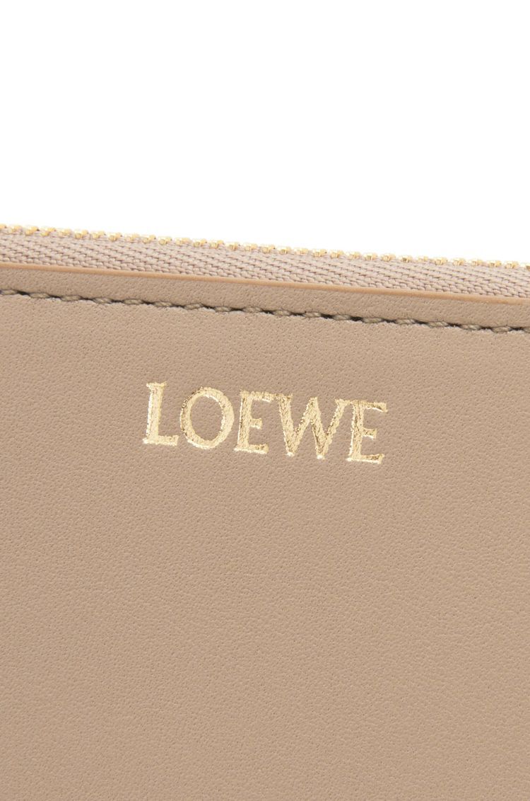 Knot compact zip around wallet in shiny nappa calfskin
