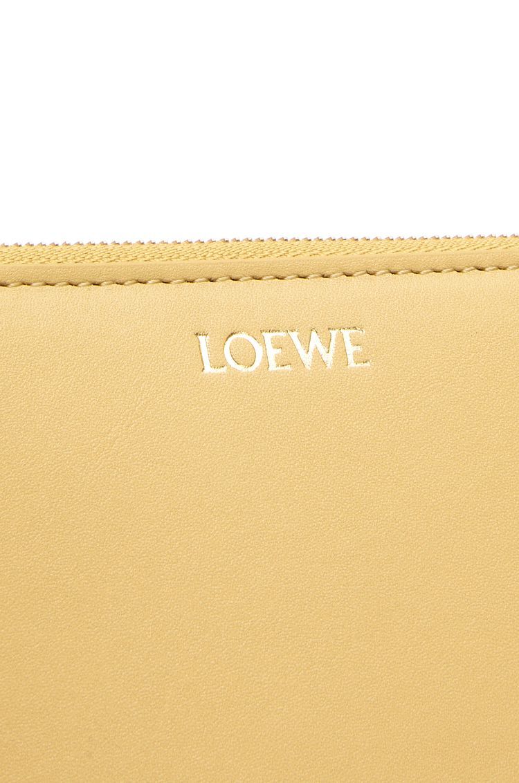 Knot compact zip around wallet in shiny nappa calfskin