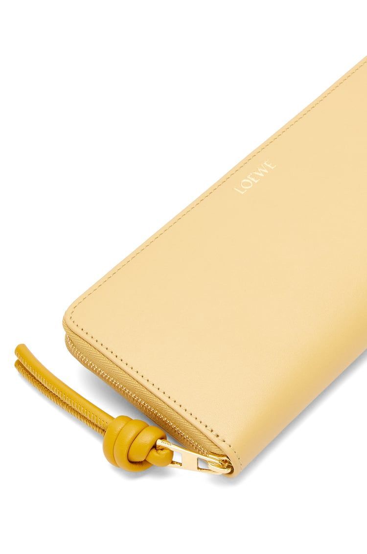 Knot zip around wallet in shiny nappa calfskin