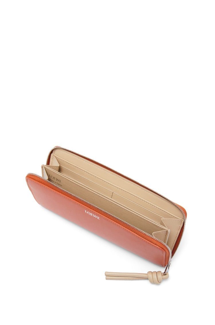 Knot zip around wallet in shiny nappa calfskin