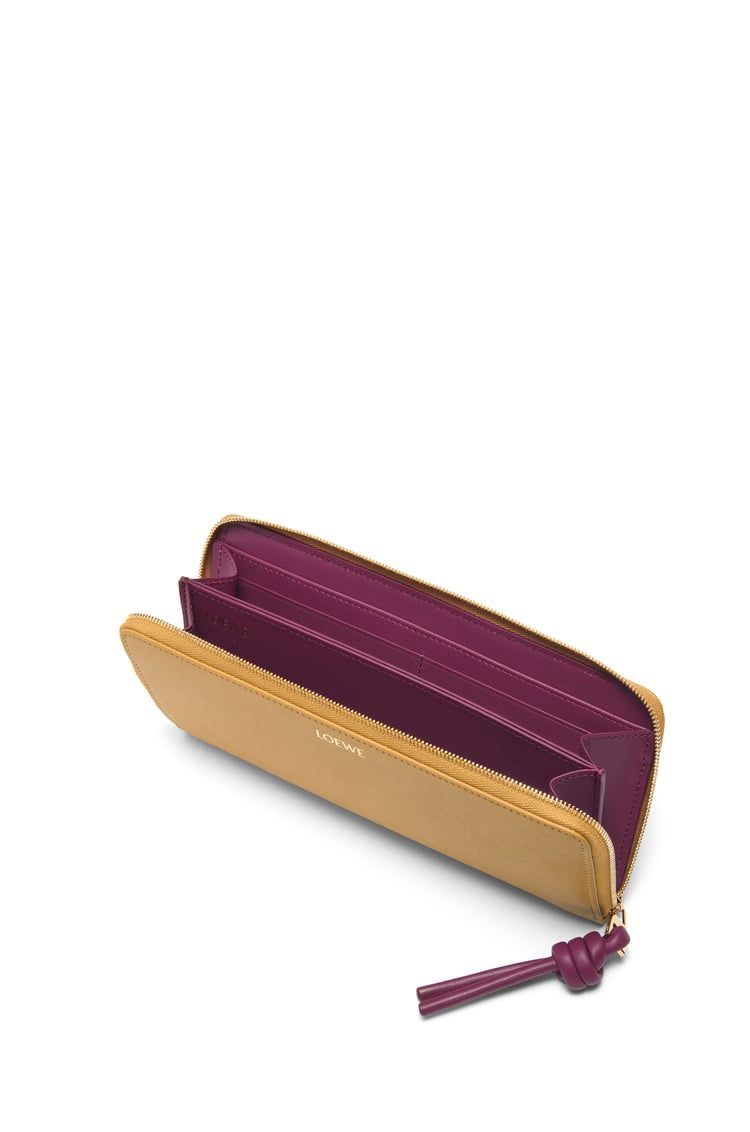 Knot zip around wallet in shiny nappa calfskin