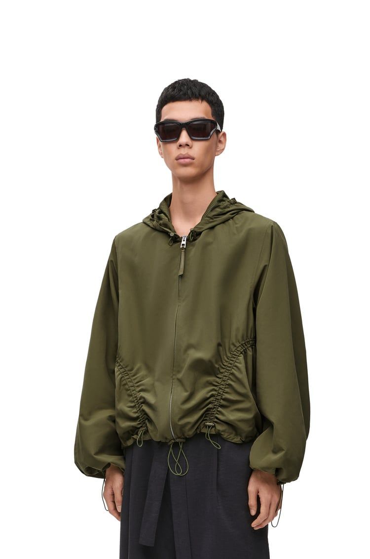 Hooded jacket in technical shell