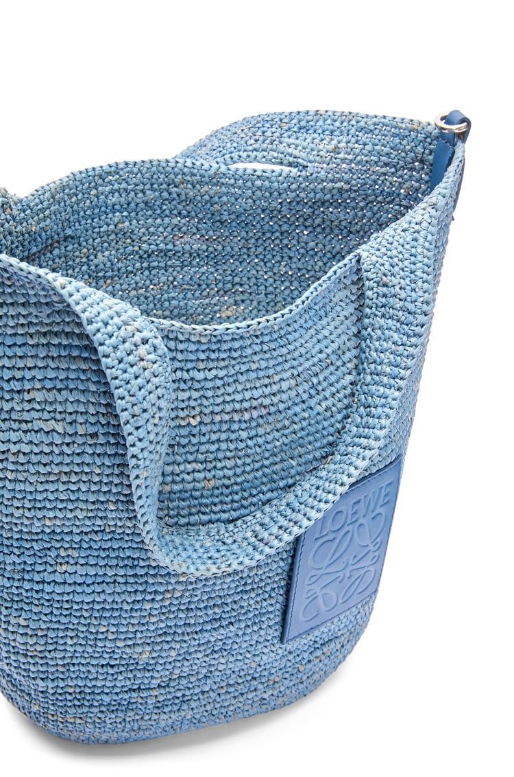 Slit bag in raffia and calfskin