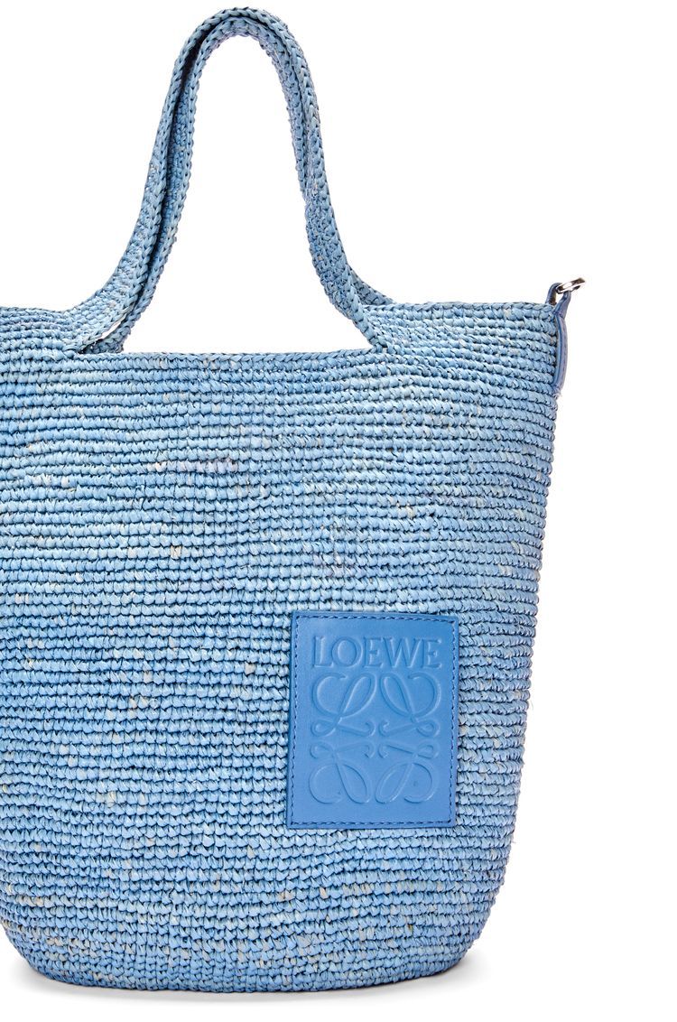 Slit bag in raffia and calfskin