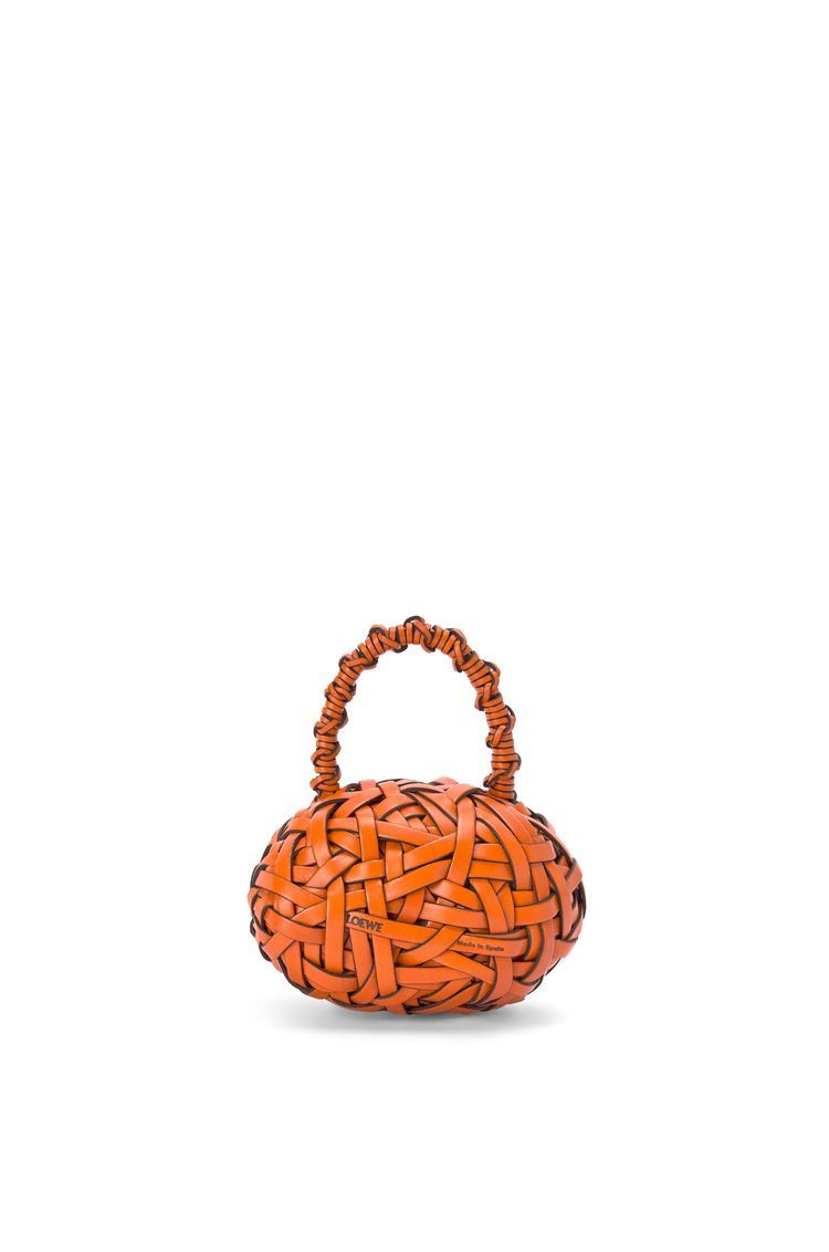 Nest woven door stopper in stone and calfskin