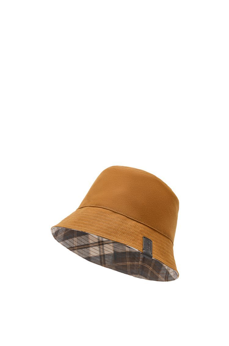 Reversible bucket hat in waxed canvas and tartan