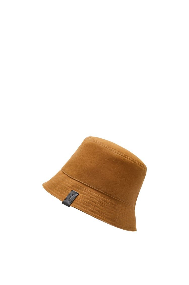 Reversible bucket hat in waxed canvas and tartan