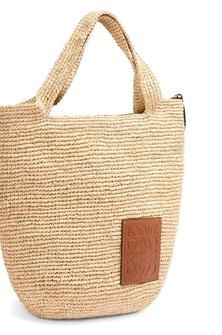 Slit bag in raffia and calfskin