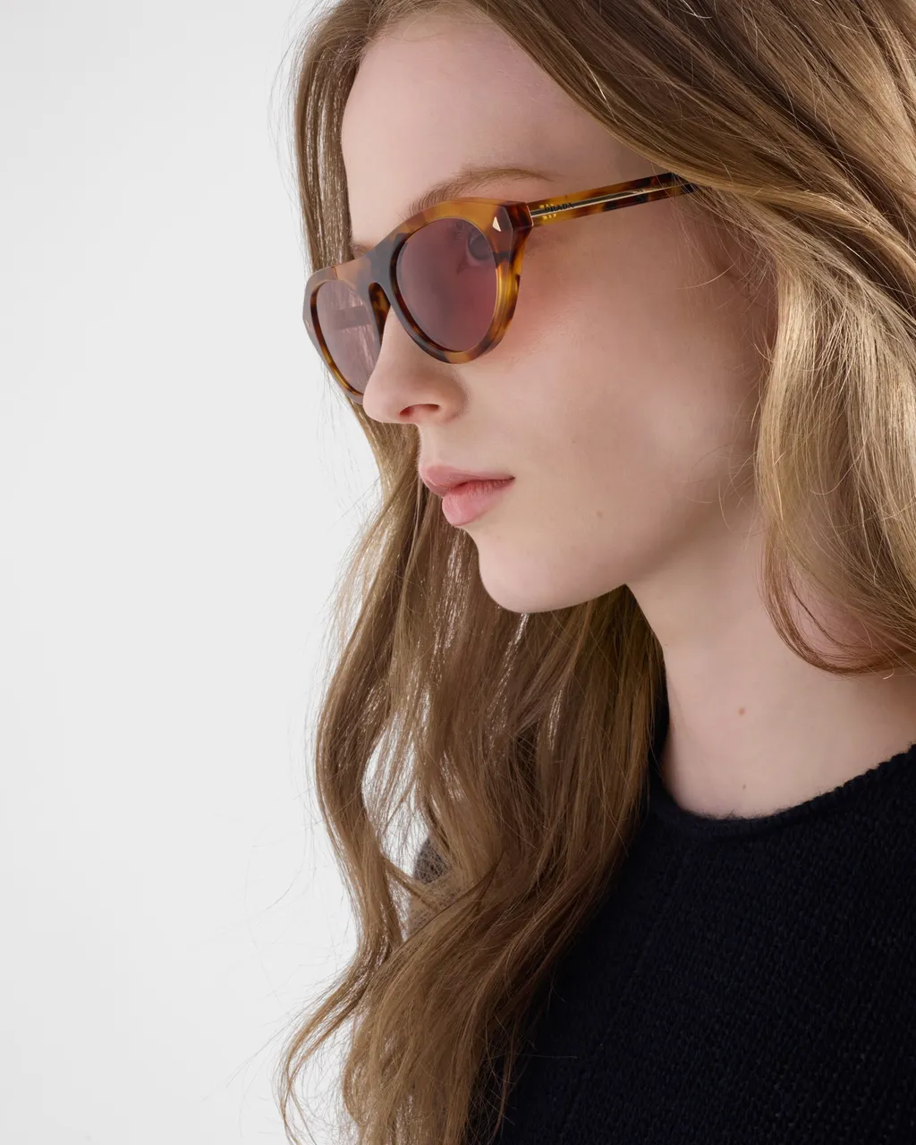 Prada Sunglasses With The Iconic Metal Plaque