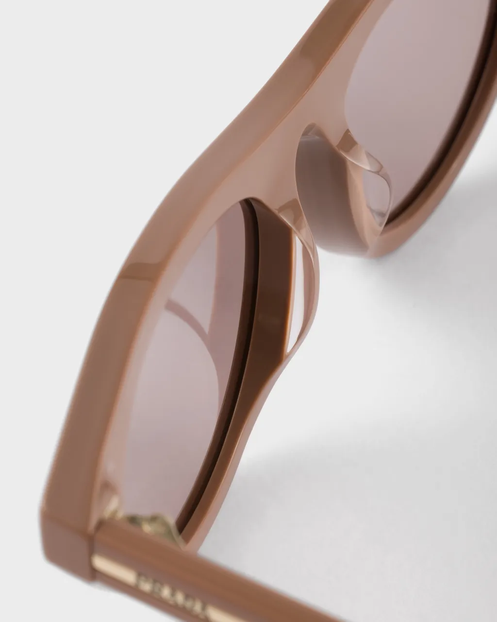 Prada Sunglasses With The Iconic Metal Plaque