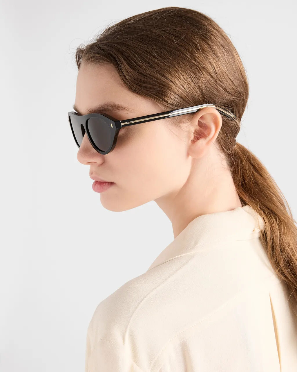 Prada Sunglasses With The Iconic Metal Plaque
