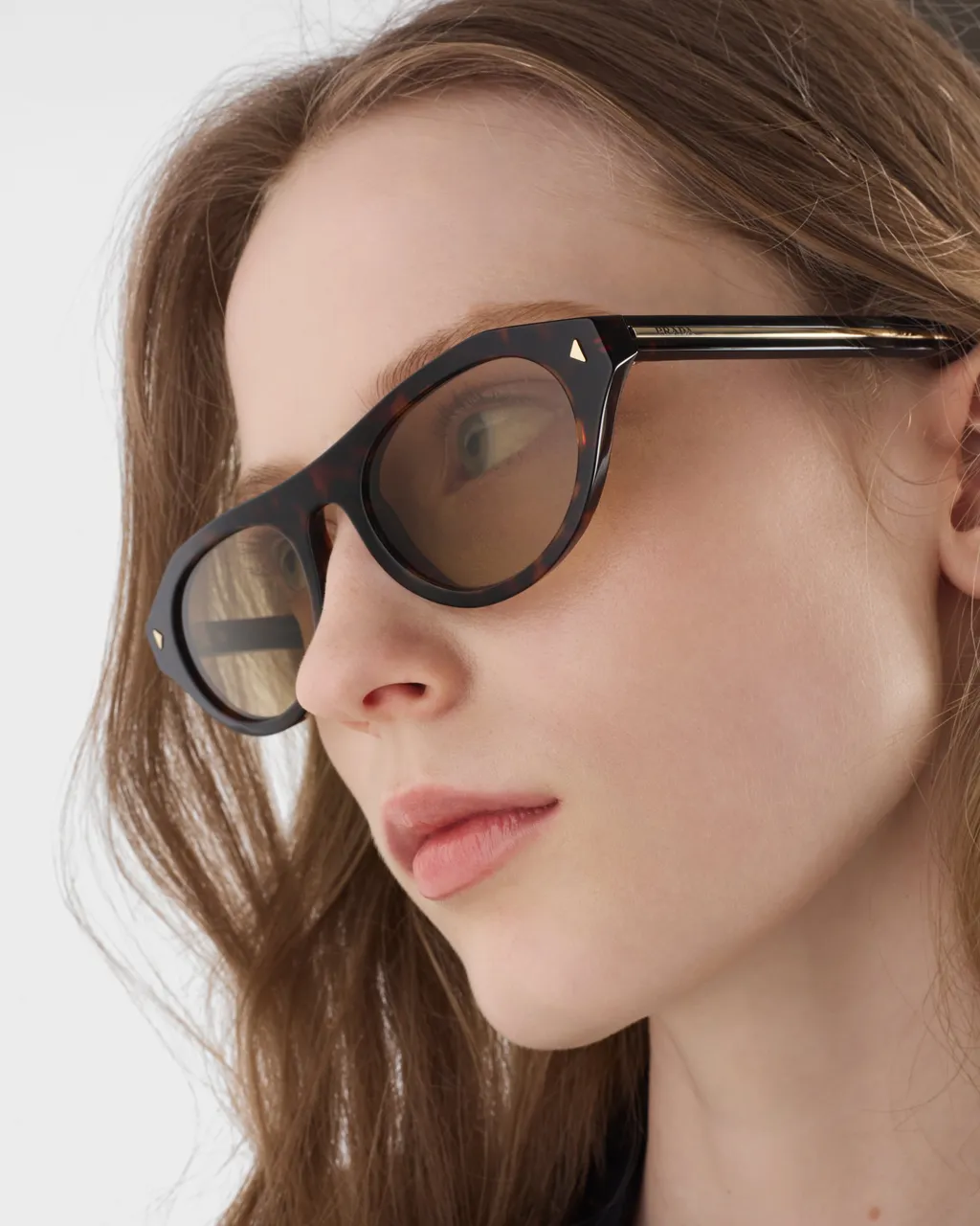 Prada Sunglasses With The Iconic Metal Plaque