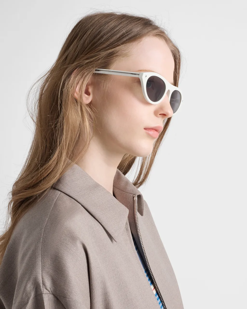 Prada Sunglasses With The Iconic Metal Plaque