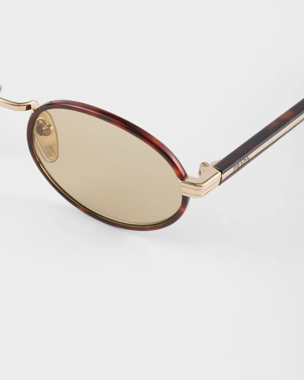 Prada Sunglasses With The Iconic Metal Plaque