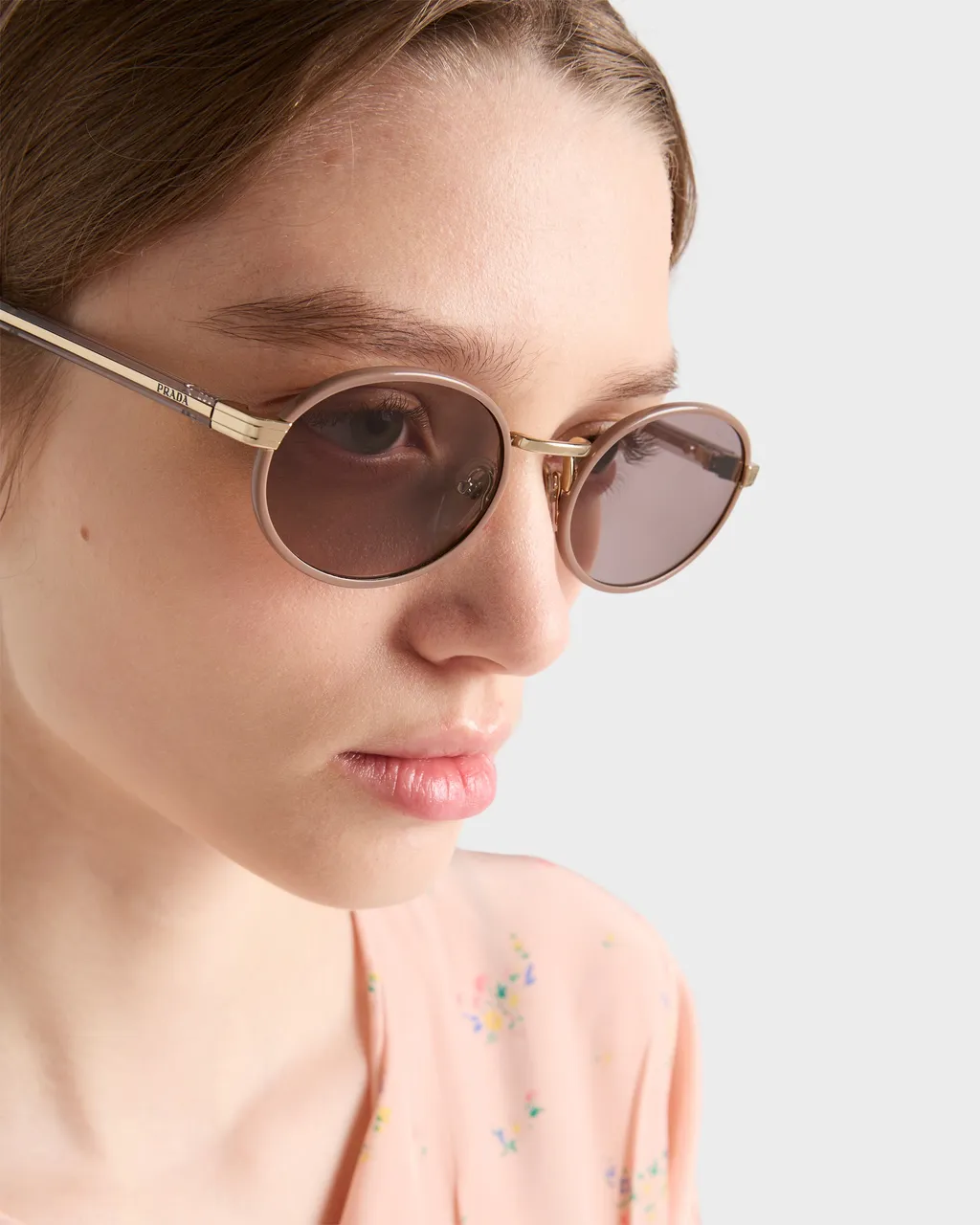 Prada Sunglasses With The Iconic Metal Plaque