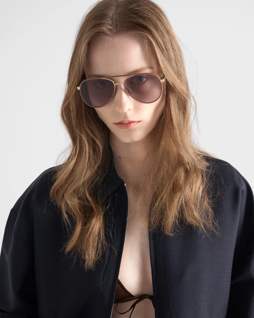 Prada Sunglasses With The Iconic Metal Plaque