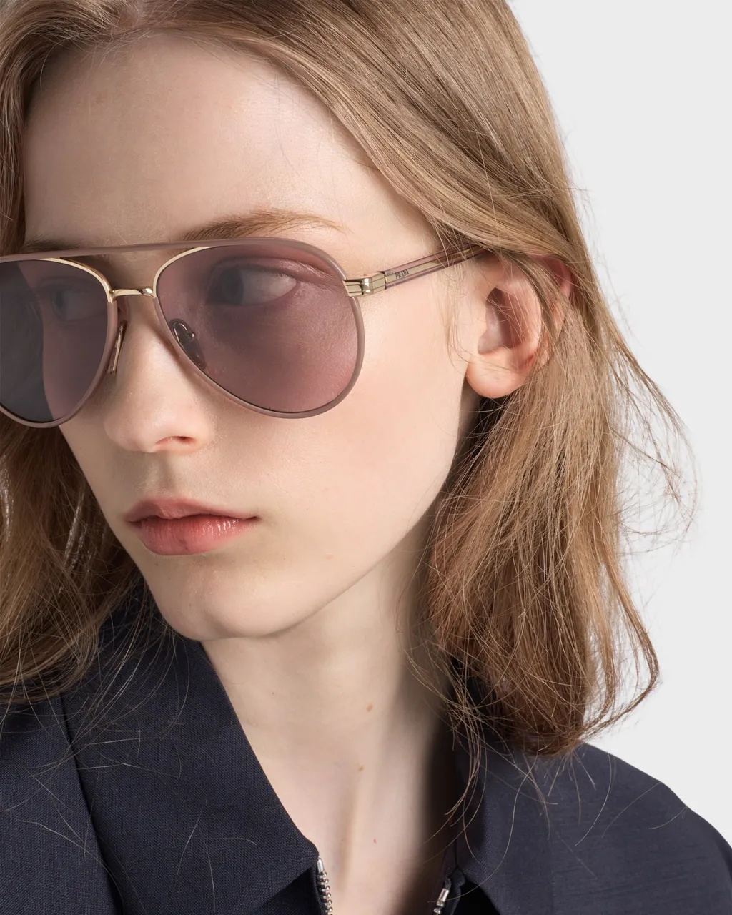 Prada Sunglasses With The Iconic Metal Plaque