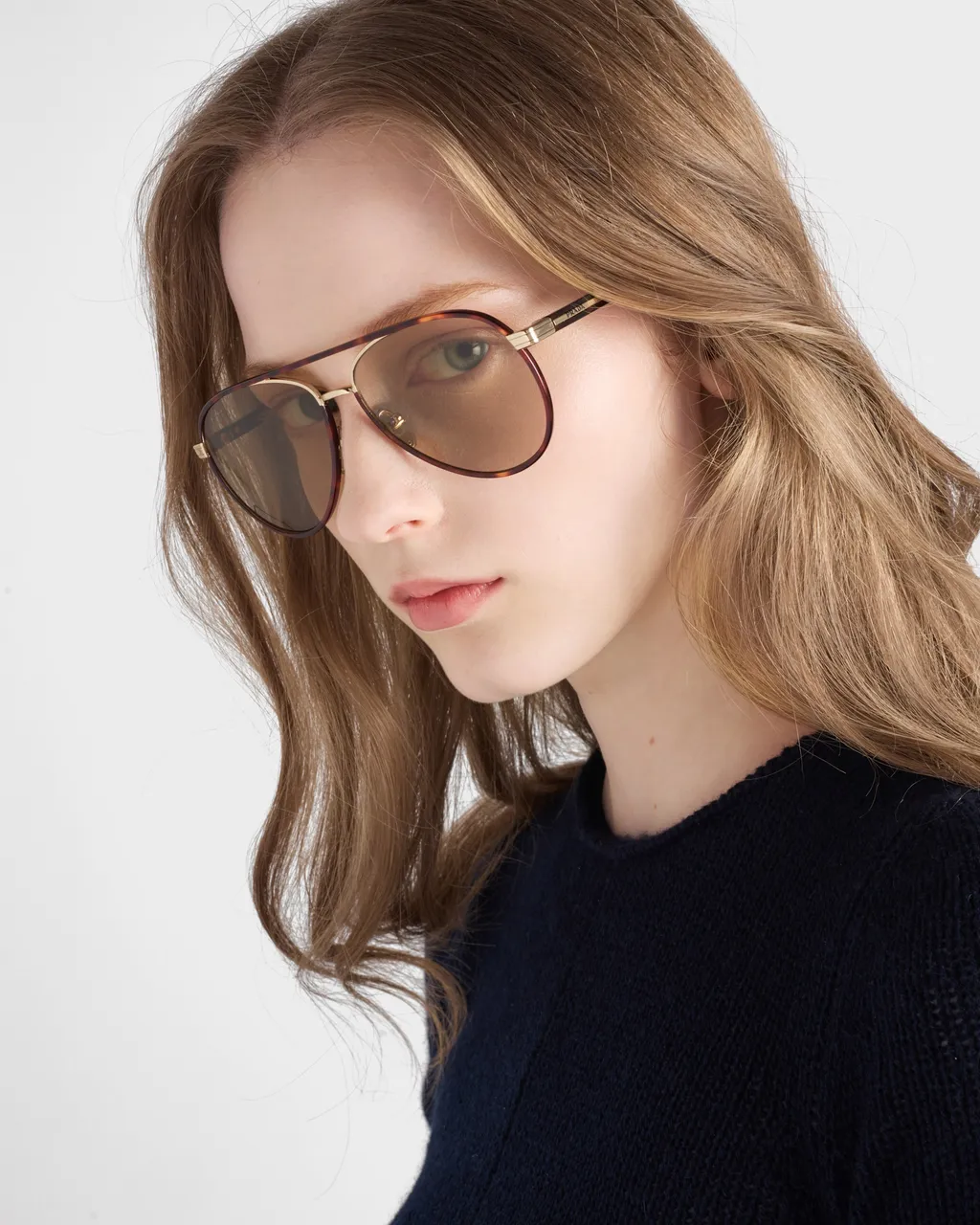 Prada Sunglasses With The Iconic Metal Plaque
