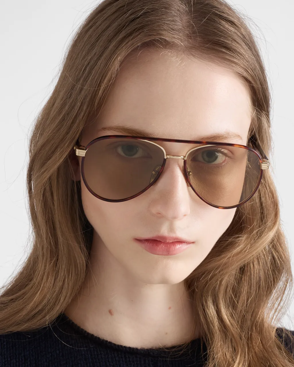 Prada Sunglasses With The Iconic Metal Plaque
