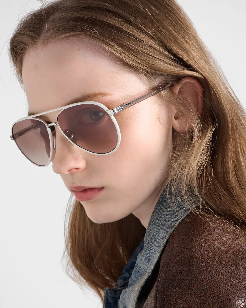 Prada Sunglasses With The Iconic Metal Plaque