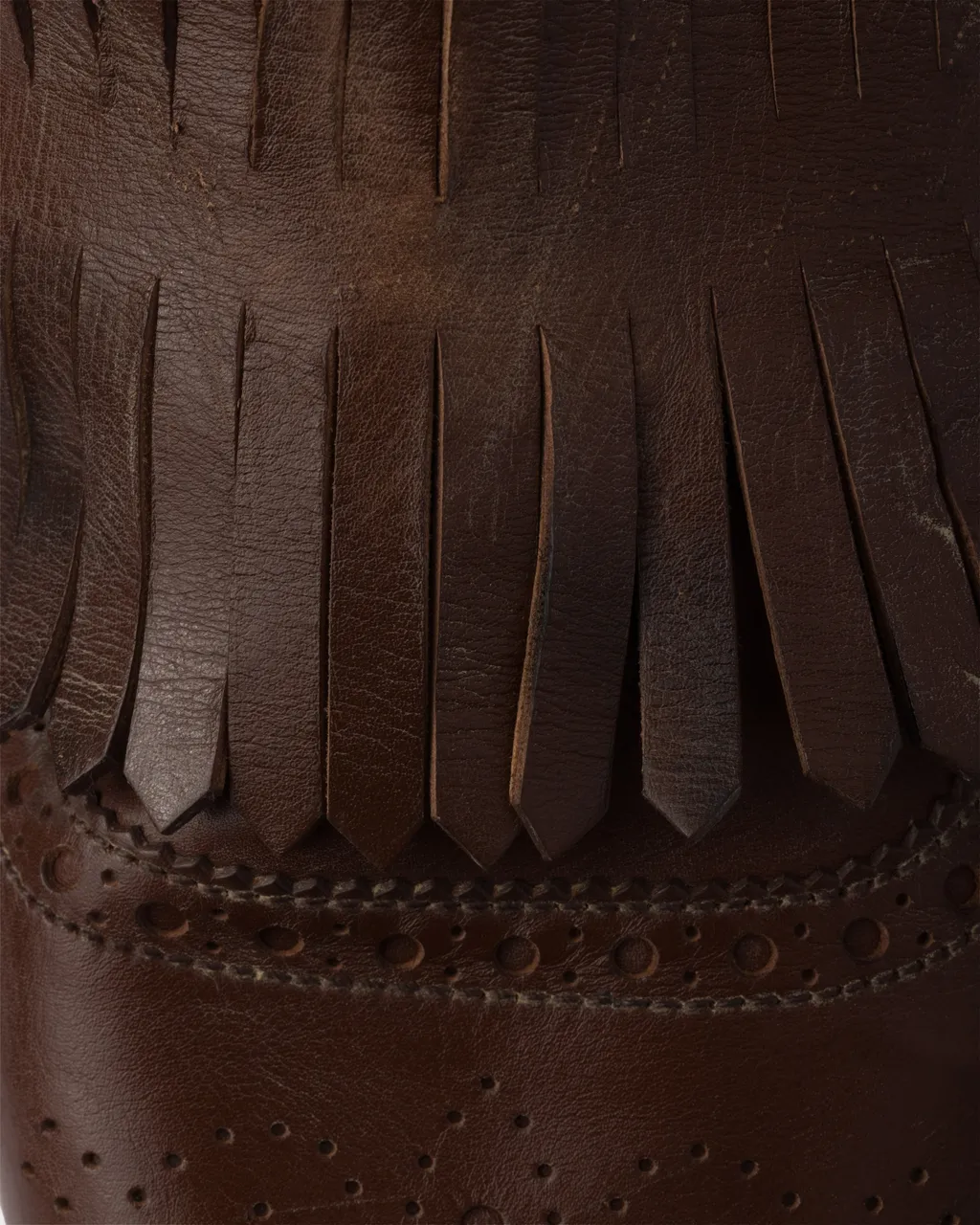Shuffle Antiqued Leather Mules With Buckled Strap And Fringe