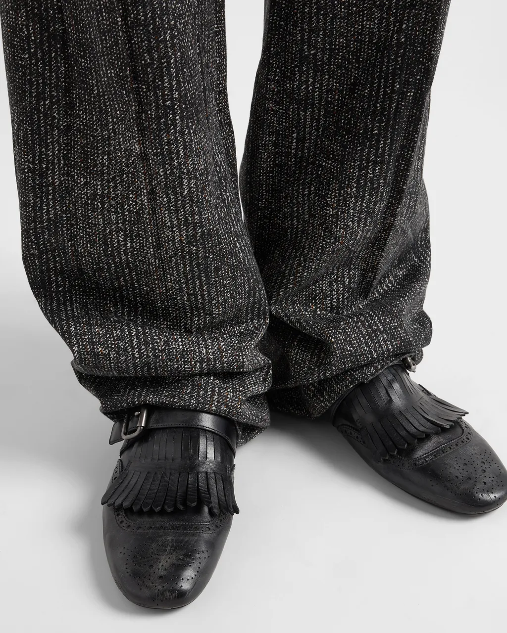 Shuffle Antiqued Leather Mules With Buckled Strap And Fringe
