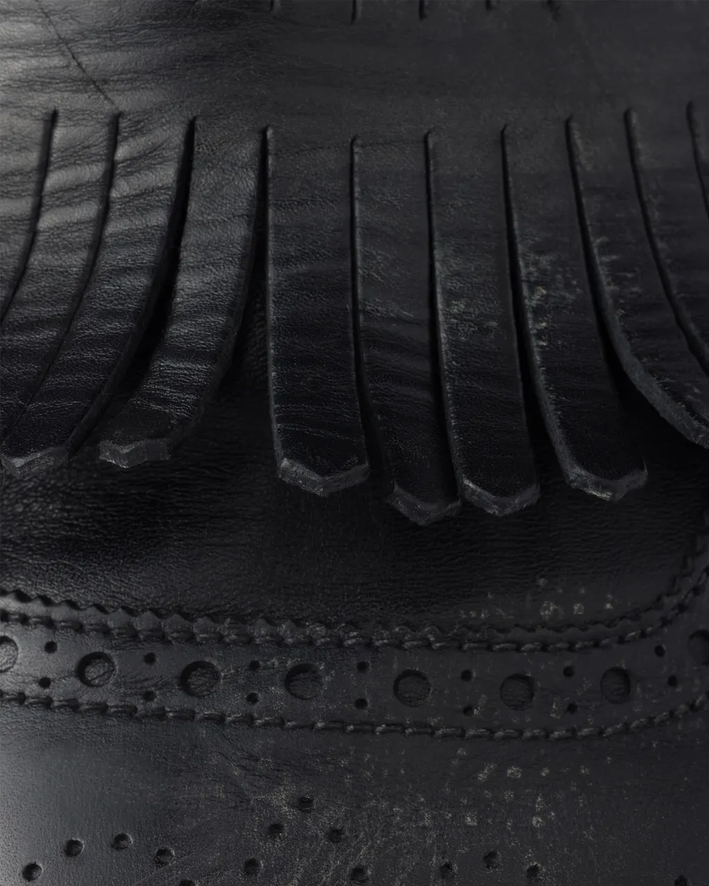 Shuffle Antiqued Leather Mules With Buckled Strap And Fringe