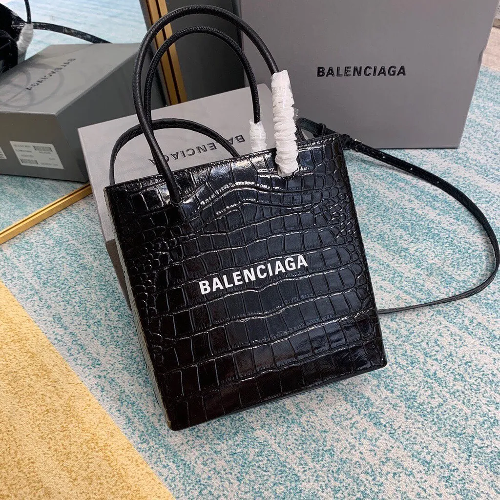 Xxs Shopping Embossed Emblem Handbag