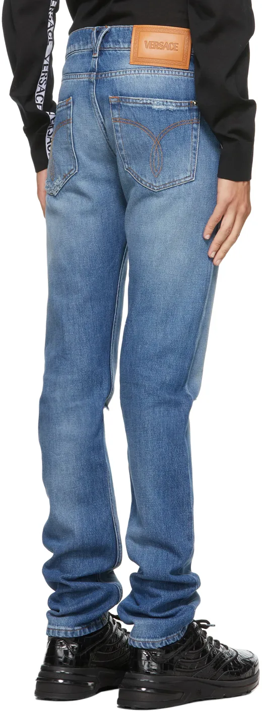 Logo-Patch Distressed Denim Jeans