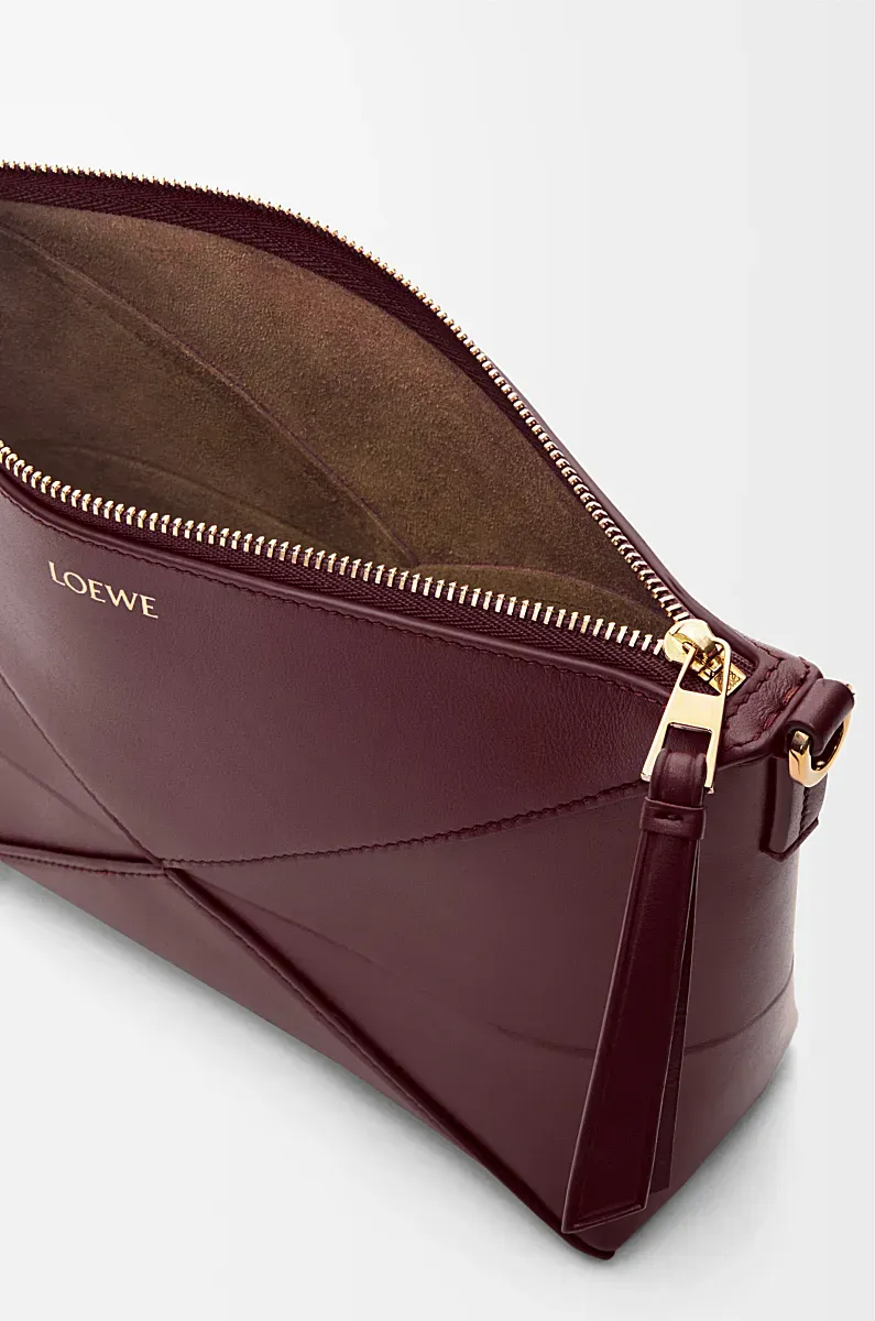 Puzzle Fold Logo Embossed Pouch Bag