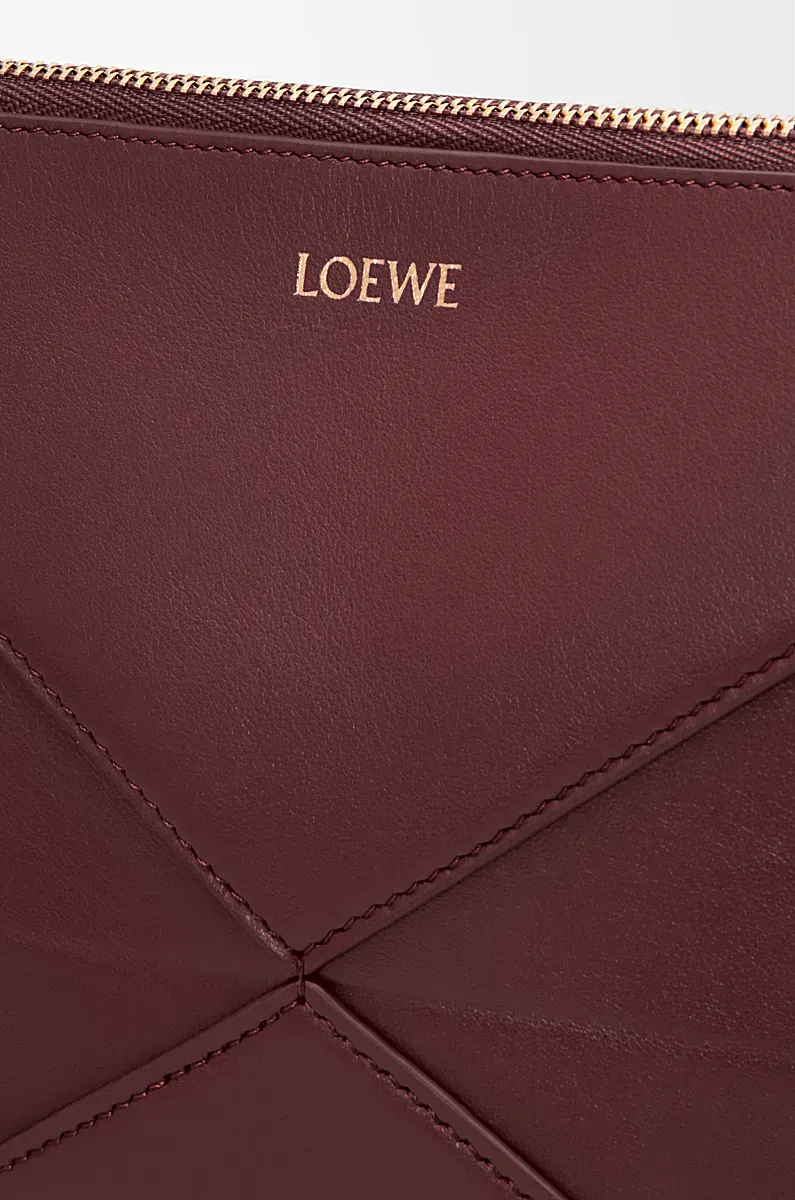 Puzzle Fold Logo Embossed Pouch Bag