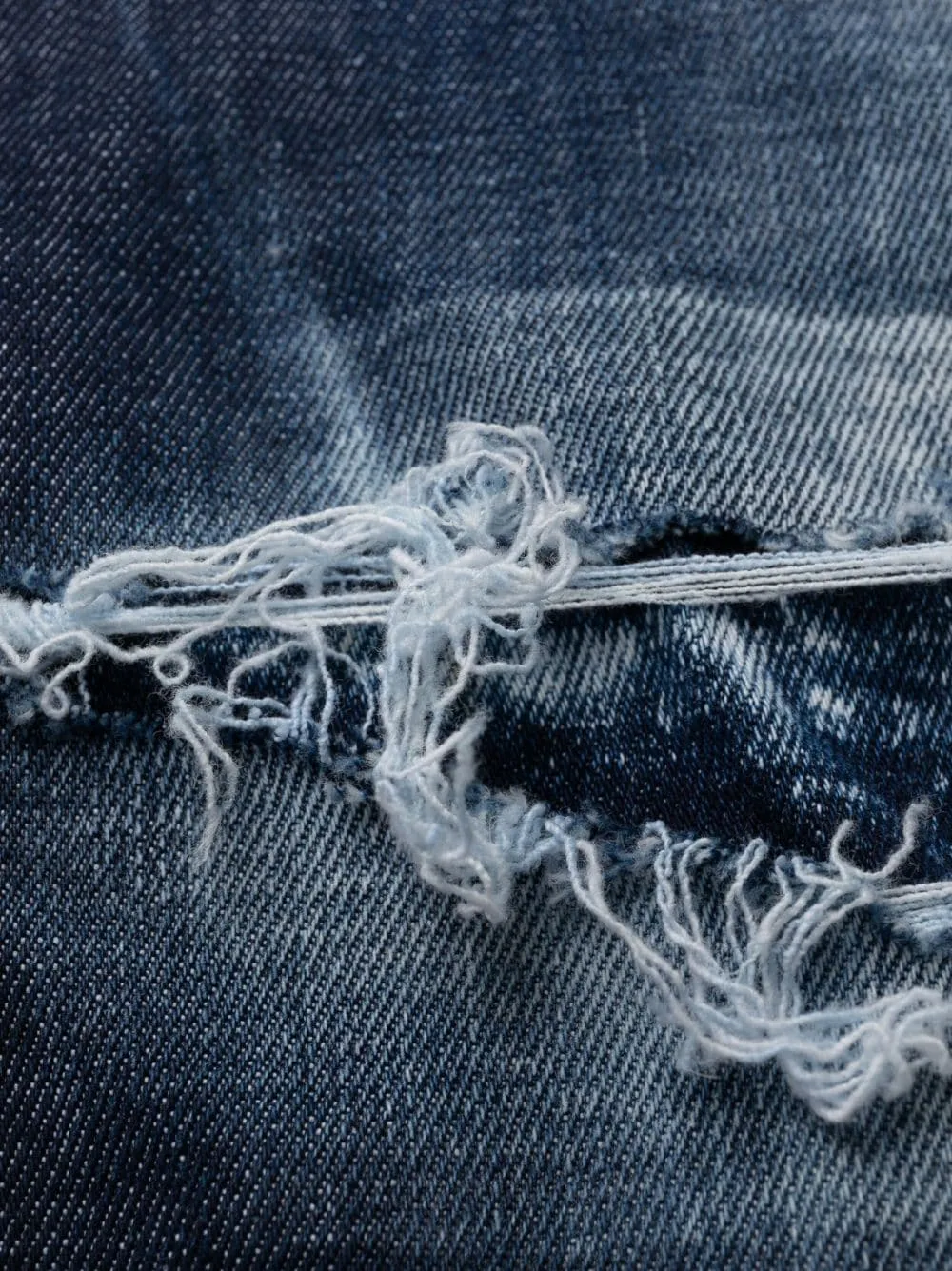 Distressed Tapered Leg Jeans