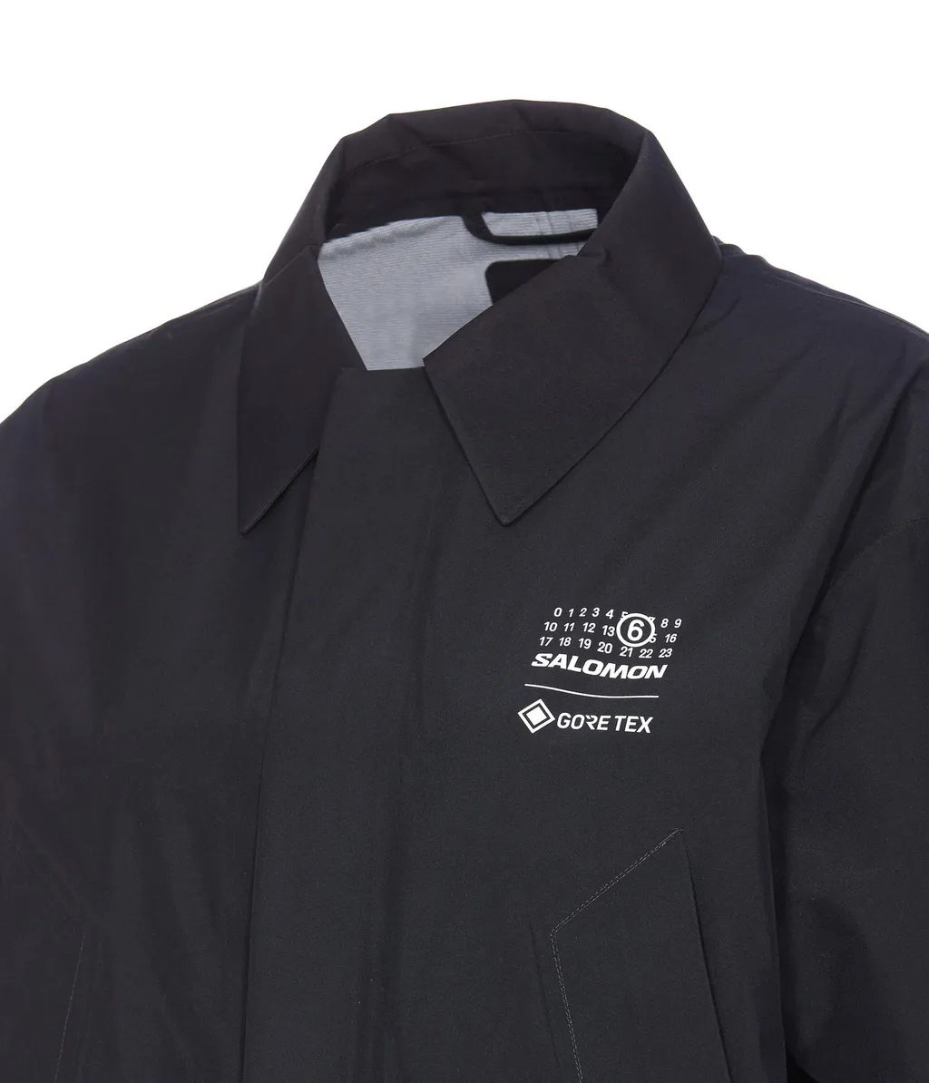 X Salomon Logo Printed Trench Coat