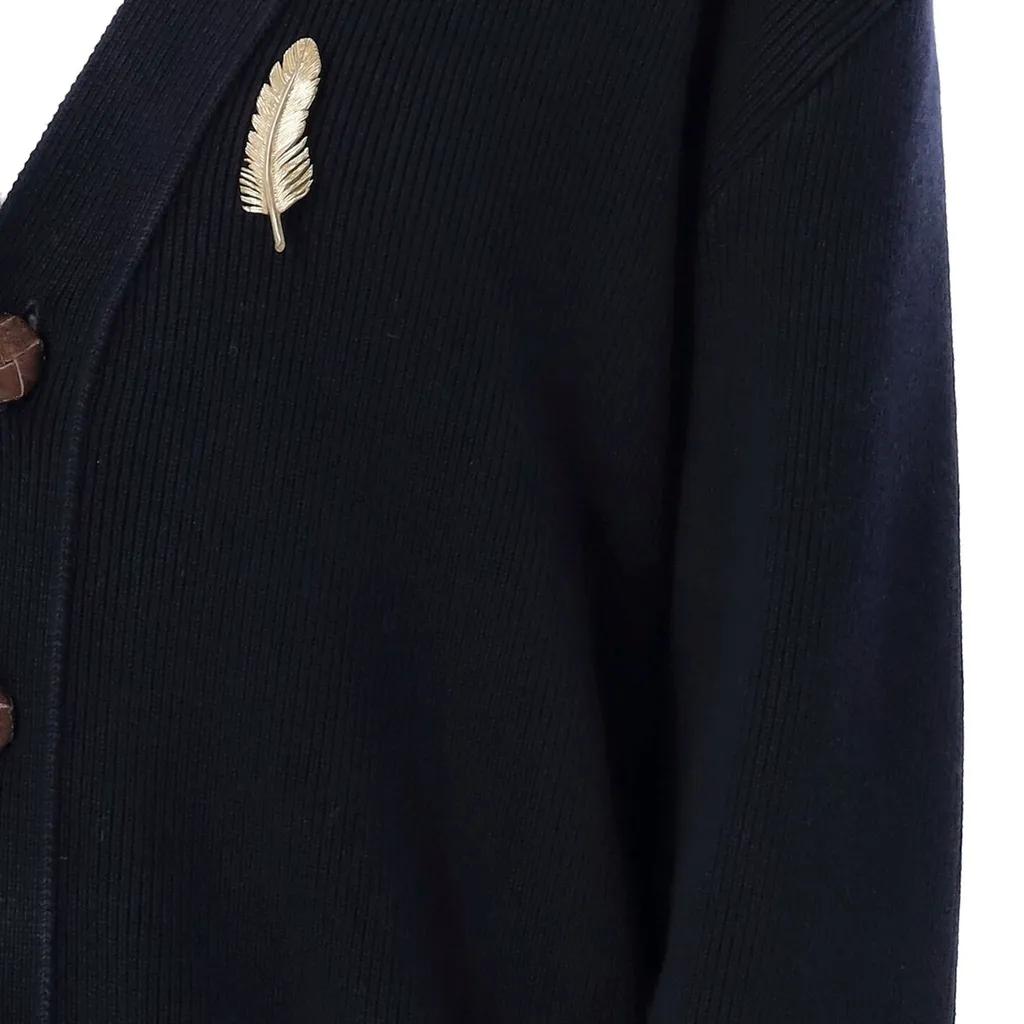 Cardigan With Feather Brooch