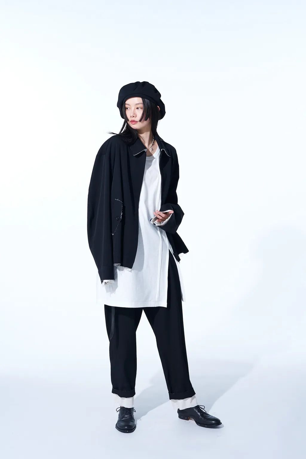 Washer Finished Wool Gabardine 2-Tuck Pants With Cut-Out Hem Design
